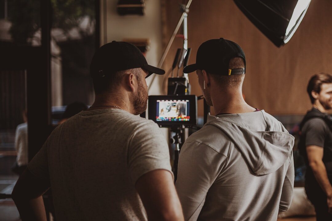 Two Portuguese podcast hosts recording an episode together